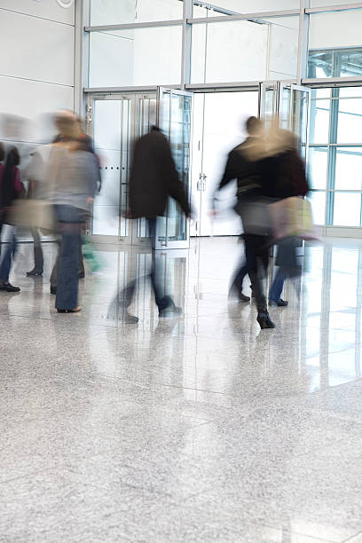istock Blurred People Walking Through Glass Doors 171582253