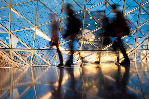 Silhouettes of People in Futuristic Interior, Blurred Motion blurs of people in a modern interior,click here to view more related images: mall walker stock pictures, royalty-free photos & images