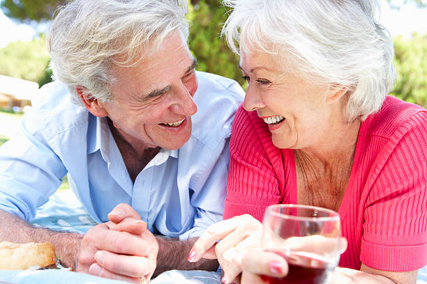 istock Senior Couple Enjoying Picnic Together 171582398