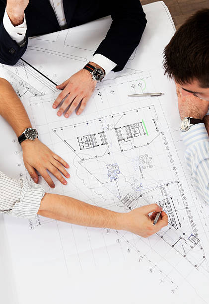istock All hands at work. Top View. Real Estate Business Developers. 171582712