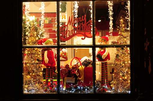 Telephoto image of Christmas decorated shop window.