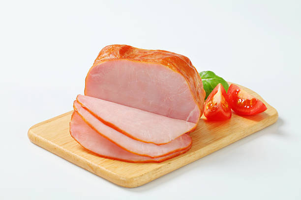 Piece of smoked ham on a cutting board