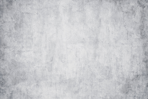 White gray stained grunge detailed concrete textured wall. Perfekt as copy space background.