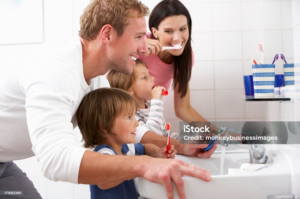 Family In Bathroom Brushing Teeth Family In Bathroom Brushing Teeth Together Family Stock Photo