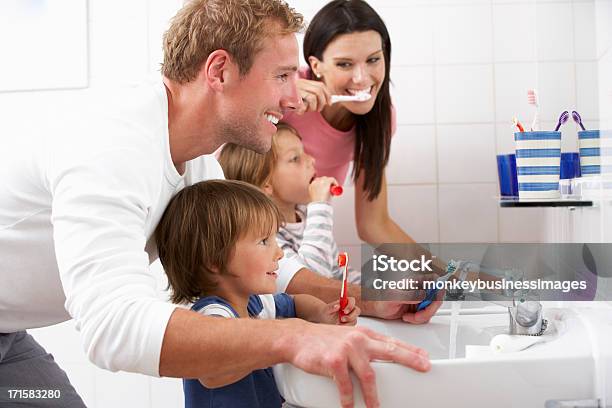 Family In Bathroom Brushing Teeth Stock Photo - Download Image Now - Family, Brushing Teeth, Child