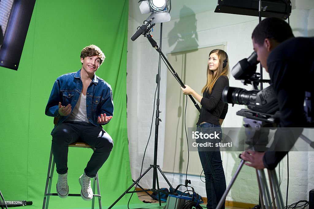 media student being interviewed media student in college tv studio Home Video Camera Stock Photo