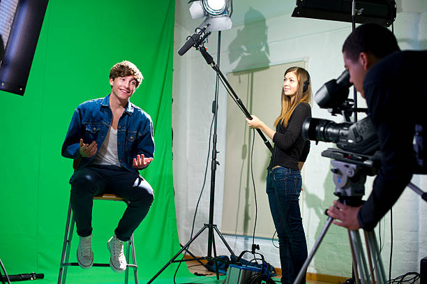media student being interviewed media student in college tv studio sound recording equipment photos stock pictures, royalty-free photos & images