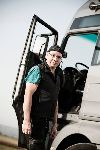 istock Driver in front of semi truck 171583352