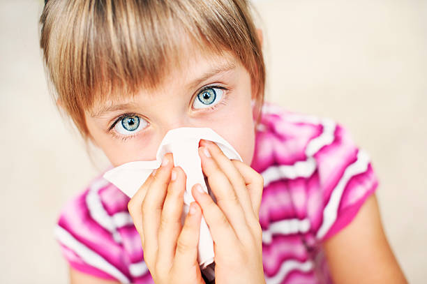 istock Little girl cleaning nose 171583451