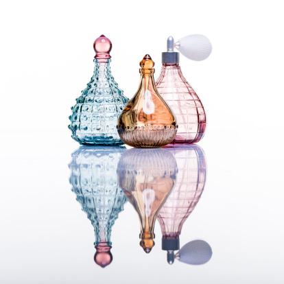 Perfume bottles studio shot on white with reflection