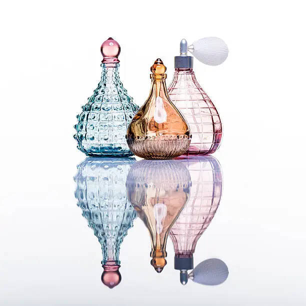 Perfume bottles studio shot on white with reflection