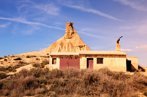 Abandoned cottage in the desert of Bardenas Reales Navarra Spain This particular rock formation is named cabezo Castildetierra