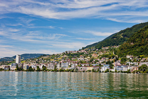 Montreux on the Swiss Riviera A view of the city of Montreux on the shores of Lake Geneva from a ship on the water on a lazy summer afternoon. montreux photos stock pictures, royalty-free photos & images