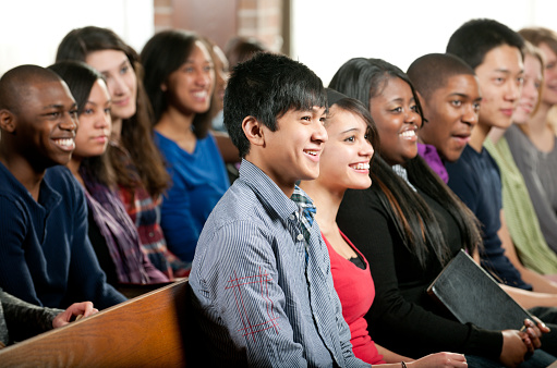 A diverse group of young adults at church. - Buy credits