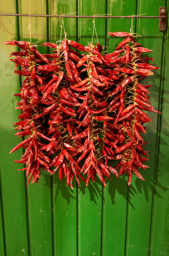 Hungarian red peppers hanging for sale.