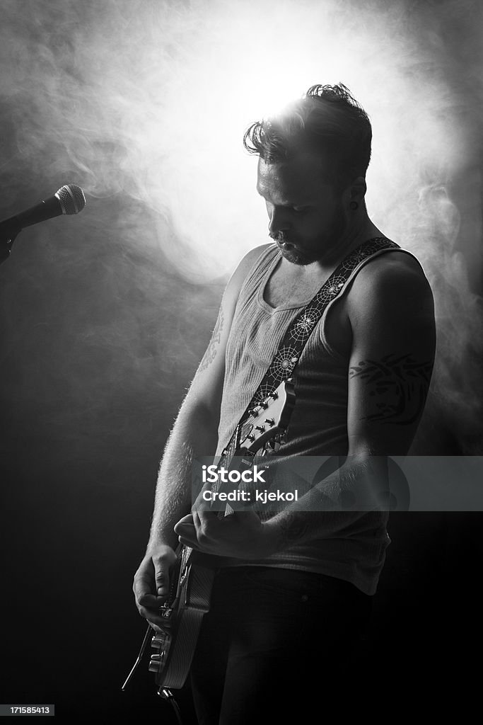 Rocker Play Guitar in Concert Young man playing rock concert. sings and play guitar. 20-29 Years Stock Photo