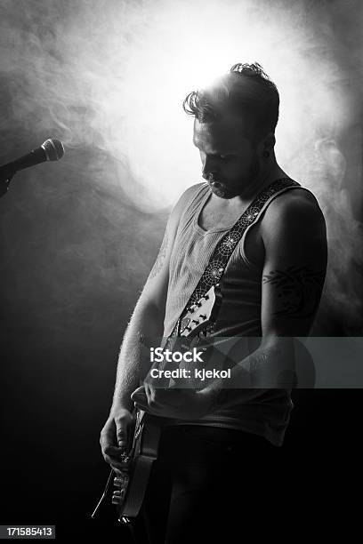 Rocker Play Guitar In Concert Stock Photo - Download Image Now - 20-29 Years, Adult, Adults Only