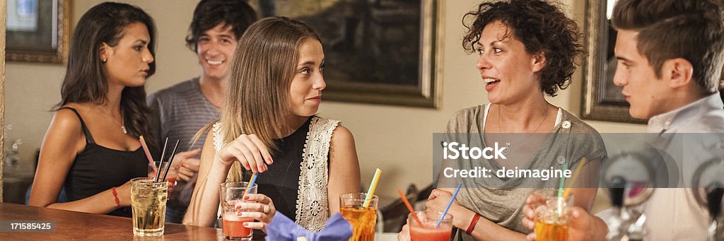 Cocktail Appetizer Beautiful girls chatting in a bar during the cocktail party. Cocktail Stock Photo