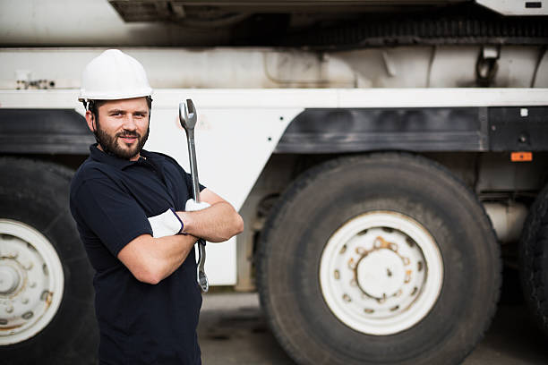 The mechanic. The mechanic doing maintenance on the crane.Similar Images: car portrait men expertise stock pictures, royalty-free photos & images