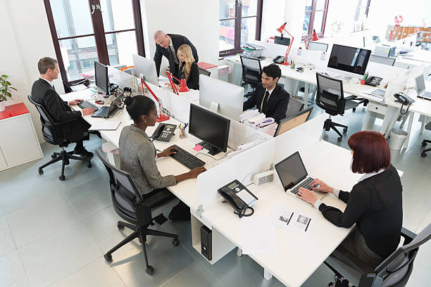 istock Busy modern office with people working at desks 171585890
