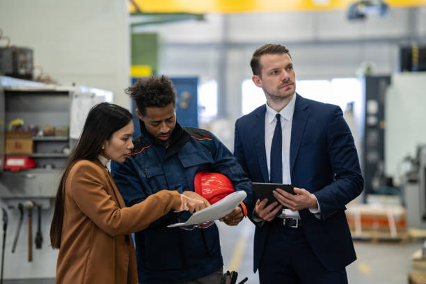 istock Managers and workers during the distribution of goods in the warehouse. 1715860276