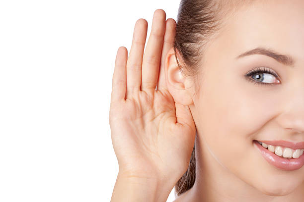 若い女性聞く - listening human ear communication human hand ストックフォトと画像
