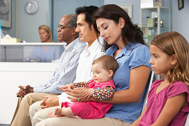 Patients In Doctors Waiting Room Patients In Busy Doctors Waiting Room 6 11 months stock pictures, royalty-free photos & images