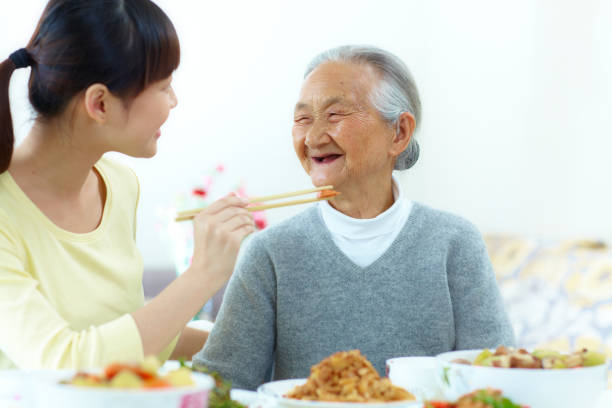 istock granddaughter have dinner with grandmother 171586401