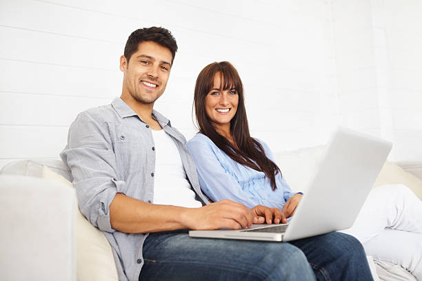 istock Young couple with a laptop sitting 171586477