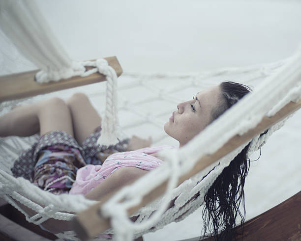 istock girl lying in a hammock 171586528