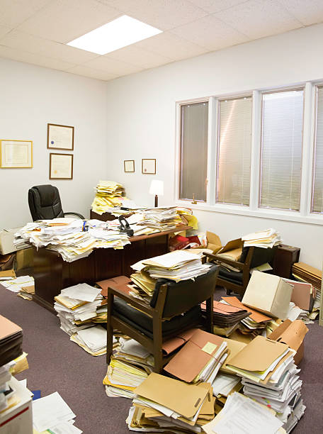 Utter Clutter- Professional paper hoarder A professional office with a really bad filing system full of cluttered papers and folders. paper hoarder stock pictures, royalty-free photos & images