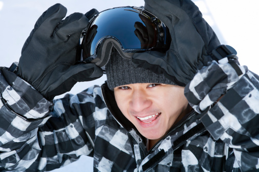 Smiling male snowboarder portrait