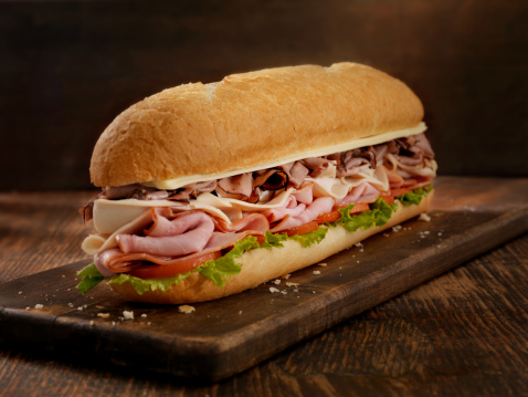 12 inch -Turkey, Ham and Roast Beef Submarine Sandwich with Mozzarella, Lettuce and Tomato on a Crusty Bun- Photographed on Hasselblad H3D2-39mb Camera