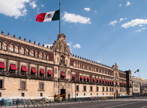 Multiple exposure of the main entrance with the Bell of Freedom, Palacio Nacional, Mexico City, Mexico.The National Palace, (or Palacio Nacional in Spanish), is the seat of the Mexican president and the federal executive in Mexico and the seat of the Mexican president. It is located on Mexico City's main square, the Plaza de la Constitucion (Zocalo). The palace is built on the ruins of Montezuma's palace.