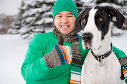 Smiling male posing with dog