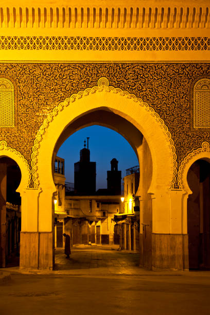Morocco The Bab Boujeloud gate of passageway into city street in Fez, Morocco. bab boujeloud stock pictures, royalty-free photos & images