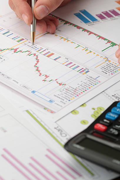 Business Meeting, man's hands pointing on graphs