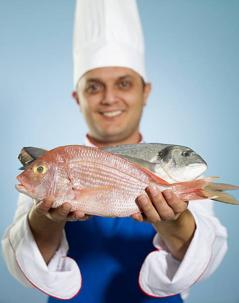 Chef Showing Raw Fish