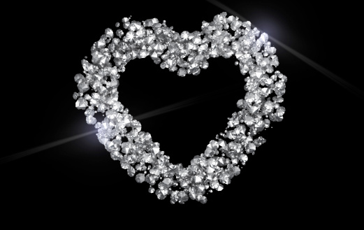 Sparkling diamond heart on black background