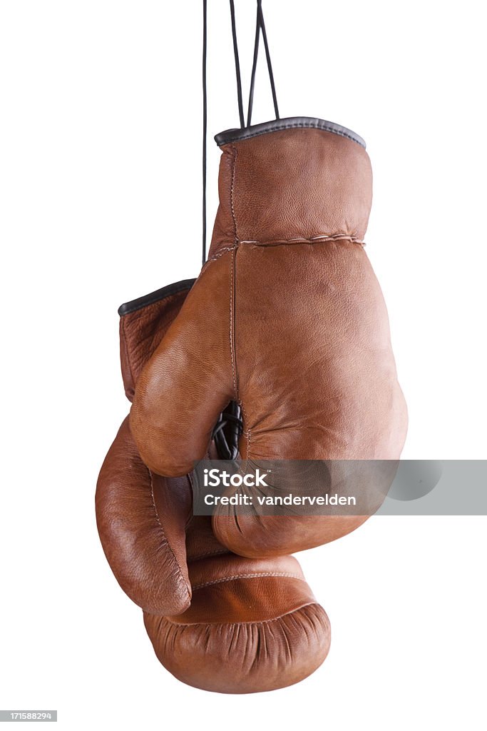 Old-fashioned Boxing Gloves Traditional leather boxing gloves hanging against a pure white background. Boxing Glove Stock Photo