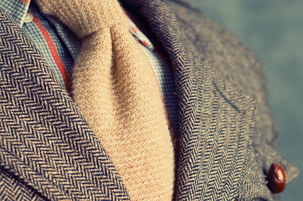 Retro vintage twill jacket with woolen necktie - Close-up Shallow depth of focus. Slightly toned. blazer jacket stock pictures, royalty-free photos & images