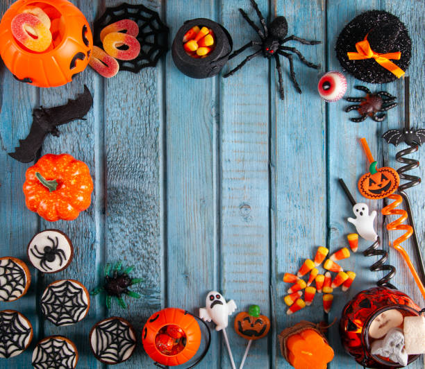 istock Halloween party decorations frame on blue wooden rustic table 1715883376