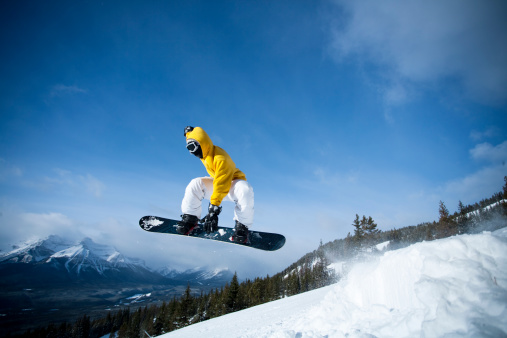 Male snowboarder in the mountain