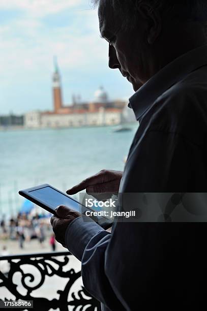 Using Digital Tablet In Venice Stock Photo - Download Image Now - Venice - Italy, 60-64 Years, 60-69 Years