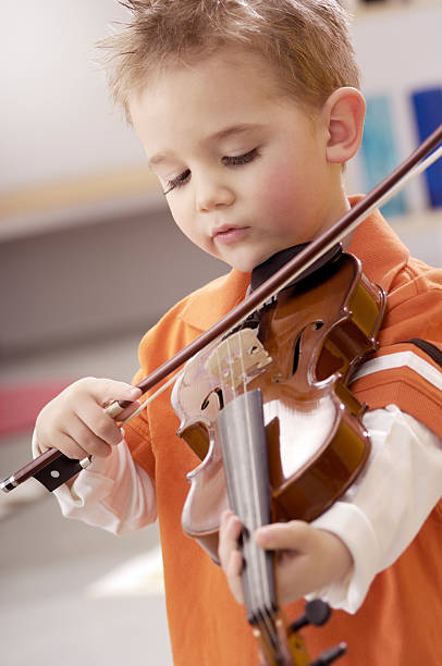 istock Cute little boy playing the violin 171588561