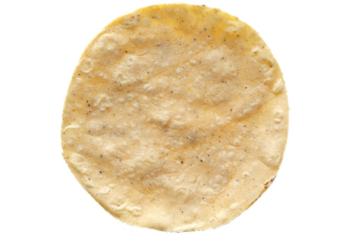A fresh corn tortilla, gluten free, isolated on white.