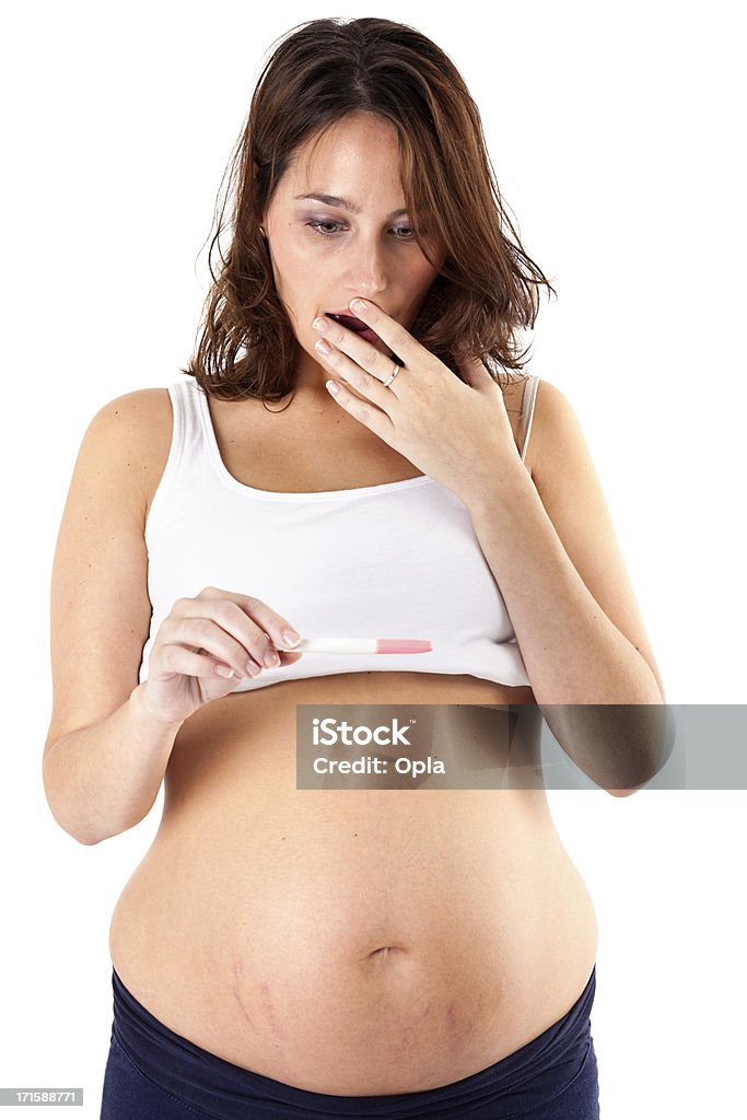 Беременная женщина с тест на беременность - Стоковые фото Растяжки - Внешний вид кожи роялти-фри