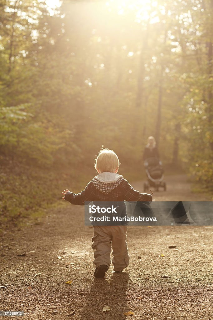 one happy day in autumn park Little boy with mother on outdoor walk in autumn park.Please check my Playground  Kids playing lightbox 12-17 Months Stock Photo