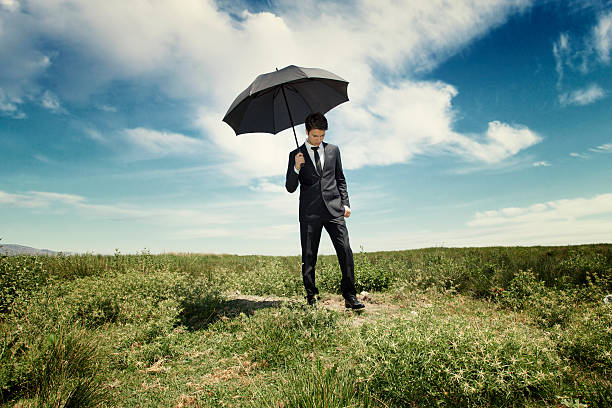 istock Young businessman with umbrella 171589002