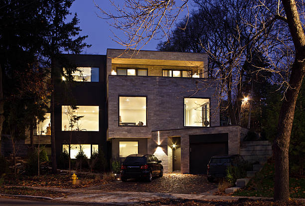 Modern House exterior Evening light exterior of large modern North American multilevel home. looking out front door stock pictures, royalty-free photos & images